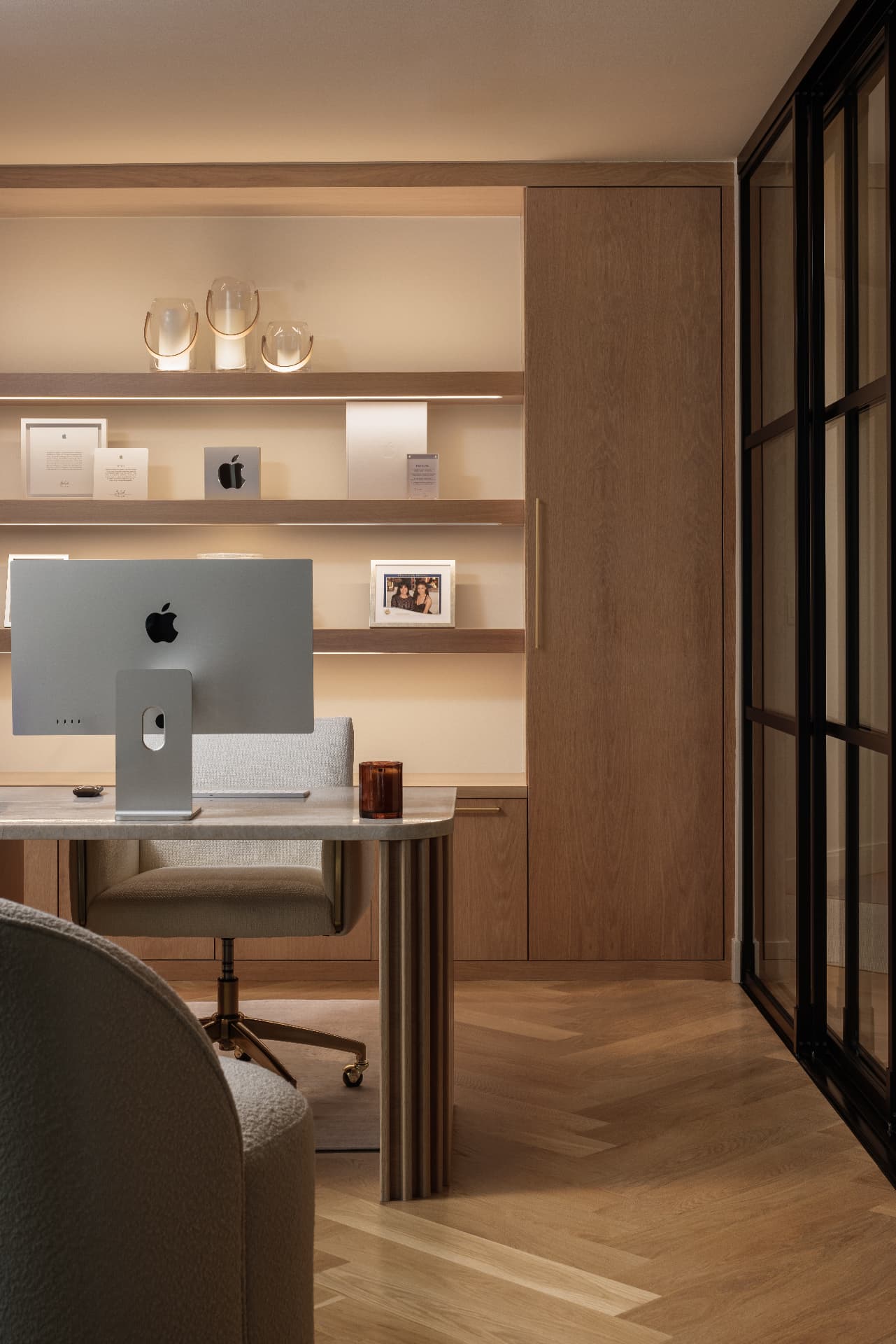 Cherry Creek home office with white oak built-ins, brass details, and glass partitions