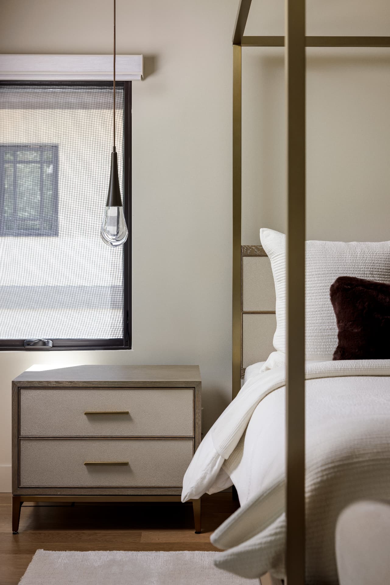 Cherry Creek bedroom detail with oak nightstand and glass pendant