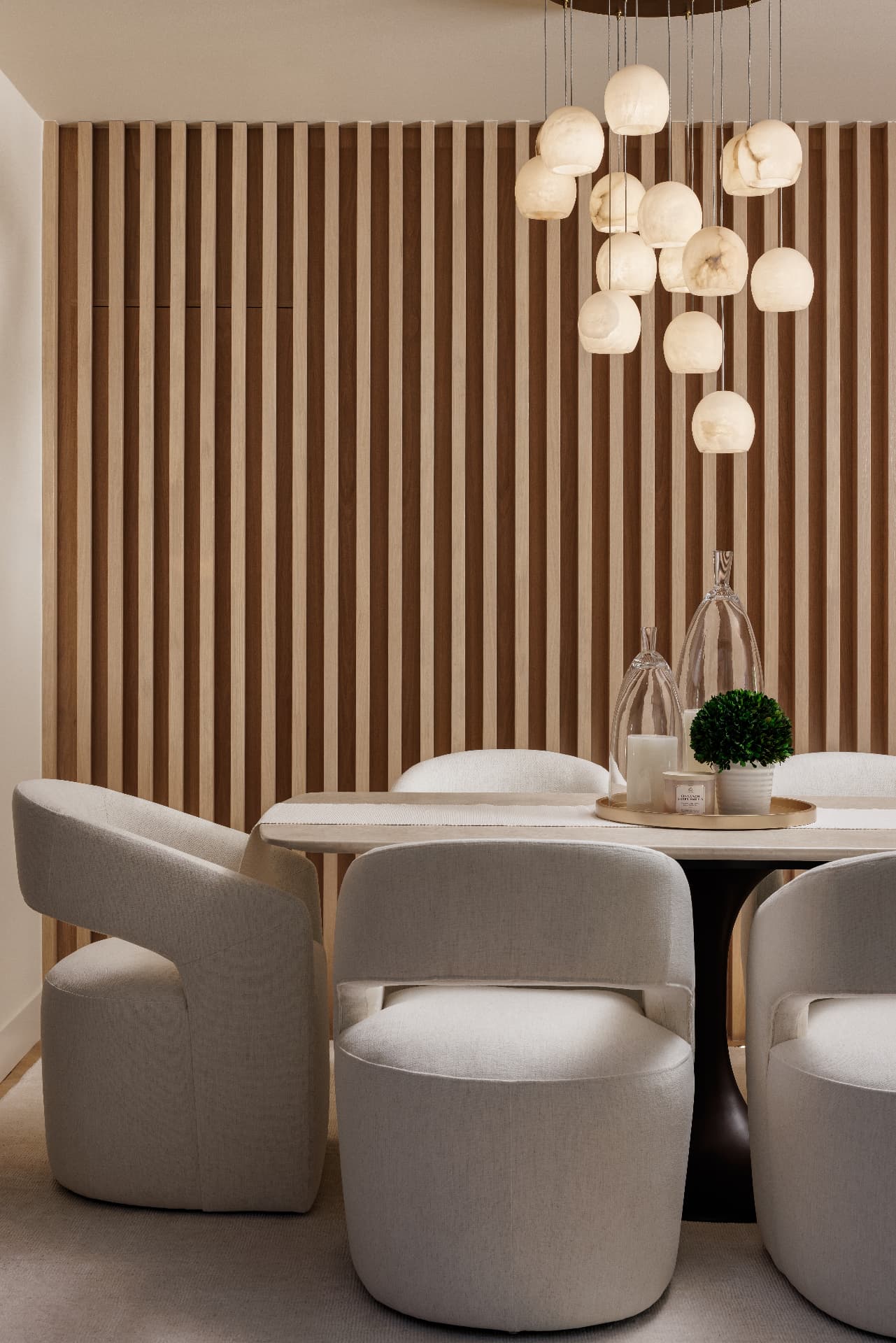 Cherry Creek dining detail with alabaster pendants against a white oak slat wall