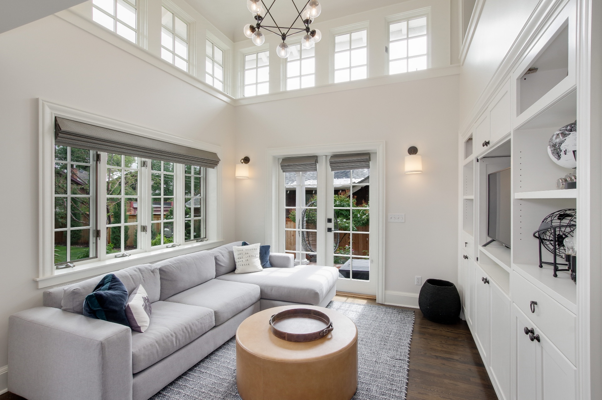 Two-story family room with clerestory windows and custom built-ins