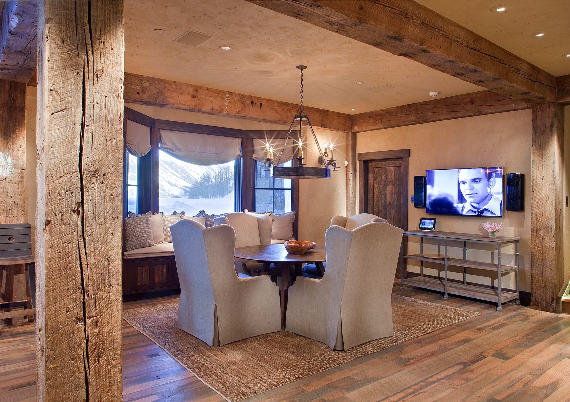 Round breakfast table with a window seat overlooking the ski slope