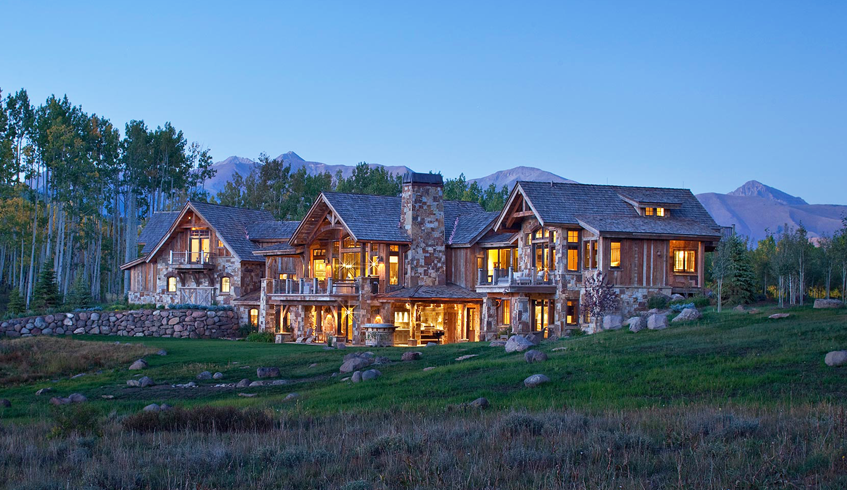 Crested Butte rustic mountain home exterior at dusk